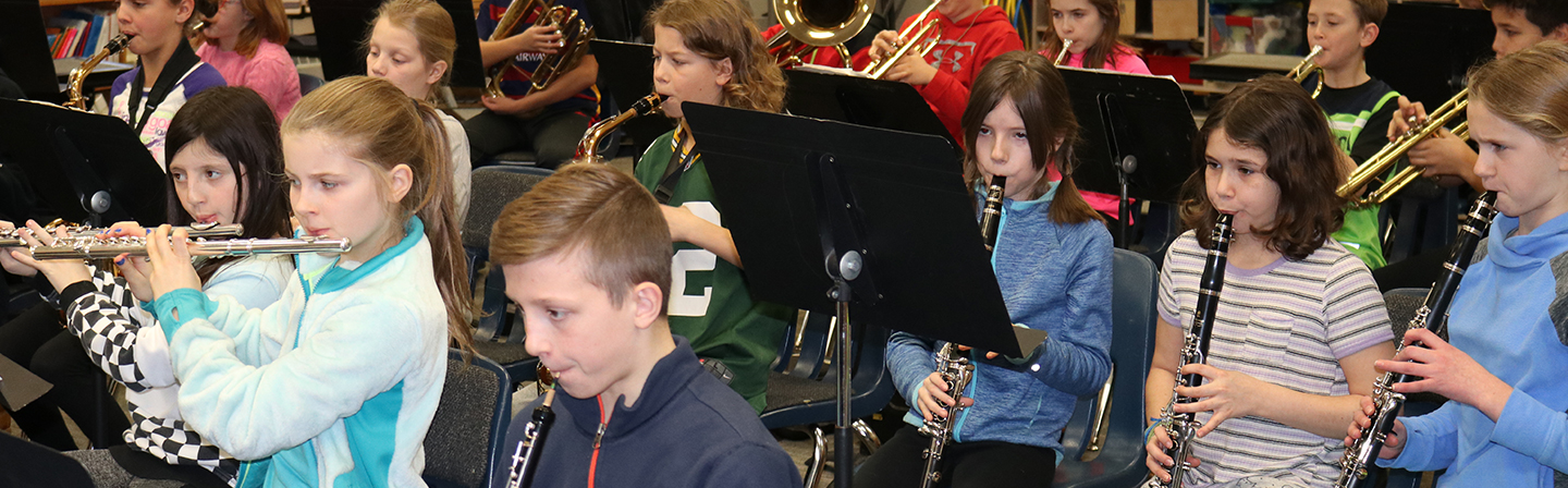 Band students playing instruments.